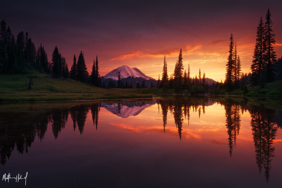 View of a lake and frosty-top mountains at dawn